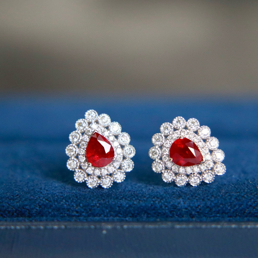 14k Gold 0.98 Ctw Natural Ruby & Diamond Earrings: Ref:231019045 // gold content:14k gold // main gemstone:ruby // shape:pear // carat weight:0. 65ct // color:red // treatment:natural // // adjacent gemstone 2 : diamond // shape:round // carat