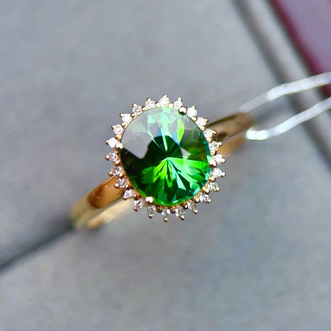 14k Gold 2.17 Ctw Natural Tourmaline & Diamond Ring: Ref:231019084 // gold content:14k gold // ring size:7. 25us // // main gemstone:tourmaline // shape:oval // carat weight:2. 05ct // color:green // treatment:natural // // adjacent gemstone 2 :