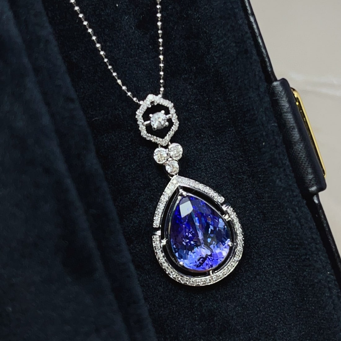 14k Gold 3.8 Ct Natural Tanzanite & Diamond & Sapphire Pendant( Without Chain ): Ref:231019089 // gold content:14k gold // main gemstone:tanzanite // shape:pear // carat weight:3. 8ct // color:blue // treatment:natural // // adjacent gemstone 2 : diamond // number of stones:70 //