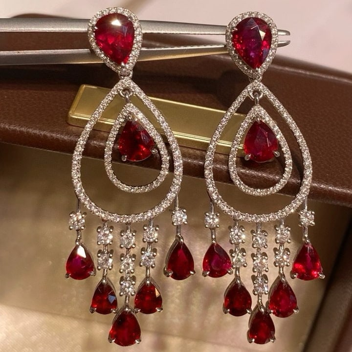14k Gold 6.42 Ctw Natural Ruby & Diamond Earrings: Ref:231019110 // gold content:14k gold // main gemstone:ruby // shape:pear // carat weight:5. 32ct // color:red // treatment:natural // // adjacent gemstone 2 : diamond // shape:round // carat weight: