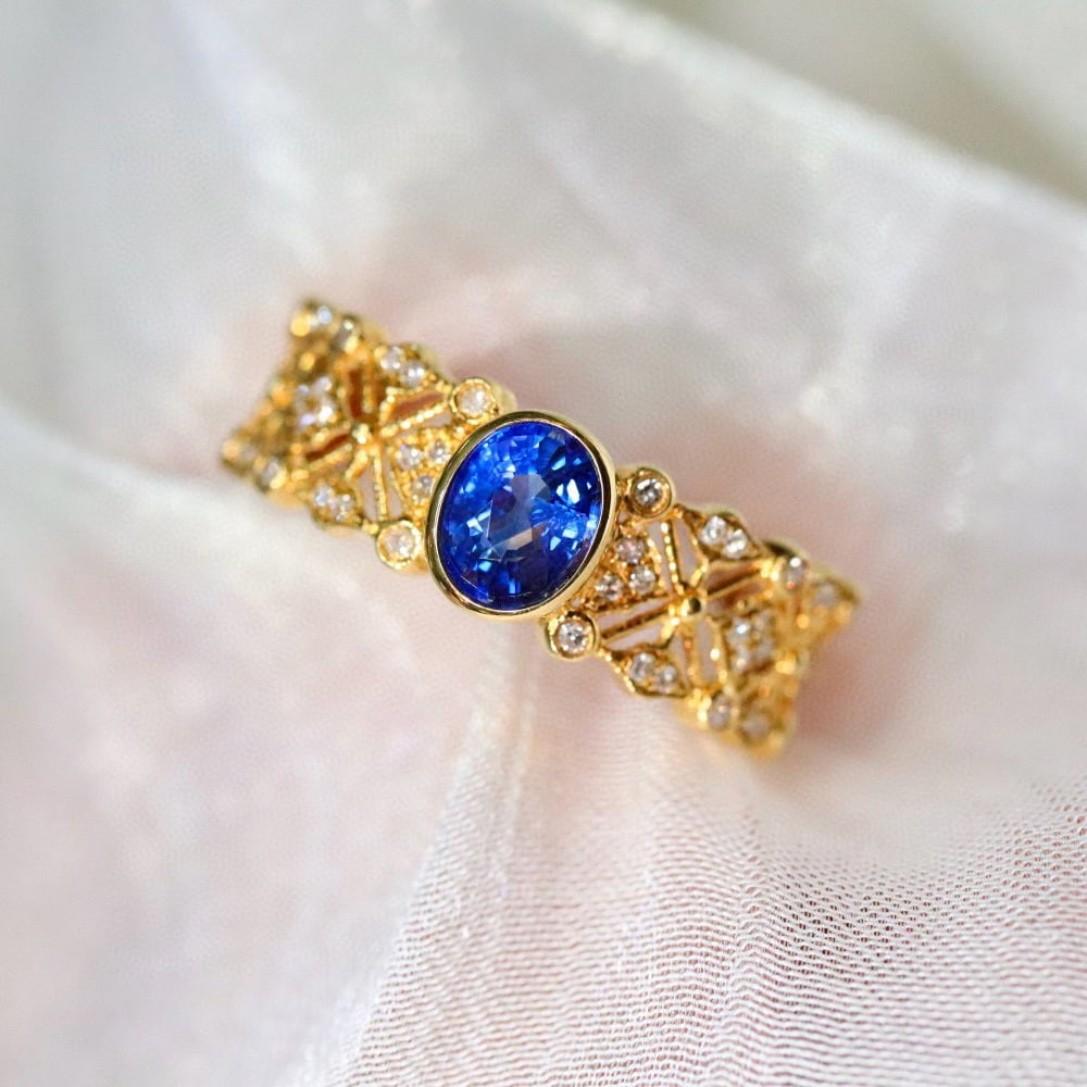 14k Gold 0.81 Ctw Natural Sapphire & Diamond Ring: Ref:231019159 // gold content:14k gold // ring size:7. 25us // // main gemstone:sapphire // shape:oval // carat weight:0. 55ct // color:blue // treatment:natural // // adjacent gemstone 2 : diamond