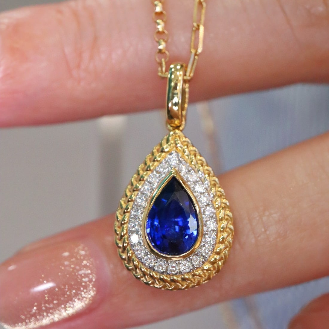 14k Gold 1.05 Ctw Natural Sapphire & Diamond Pendant( Without Chain ): Ref:231019179 // gold content:14k gold // main gemstone:sapphire // shape:pear // carat weight:0. 92ct // color:blue // treatment:natural // // adjacent gemstone 2 : diamond // shape:round // carat we