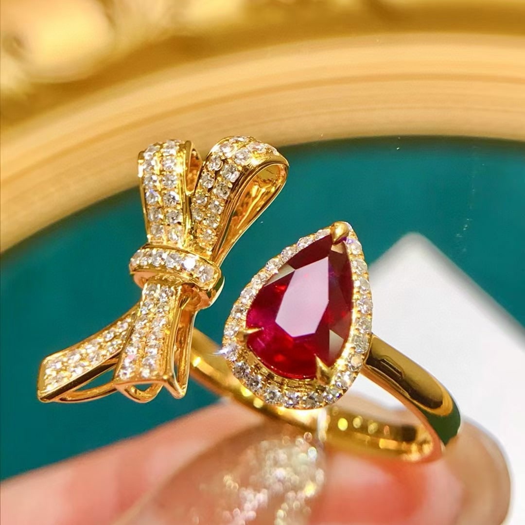 14k Gold 1.8 Ctw Natural Ruby & Diamond Ring: Ref:231019188 // gold content:14k gold // ring size:7. 25us // // main gemstone:ruby // shape:pear // carat weight:1. 4ct // color:red // treatment:natural // // adjacent gemstone 2 : diamond // shape