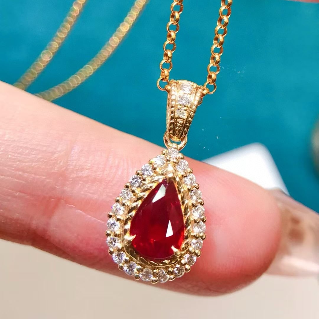 14k Gold 1.12 Ctw Natural Ruby & Diamond Pendant( Without Chain ): Ref:231019218 // gold content:14k gold // main gemstone:ruby // shape:pear // carat weight:0. 8ct // color:red // treatment:natural // // adjacent gemstone 2 : diamond // shape:round // carat