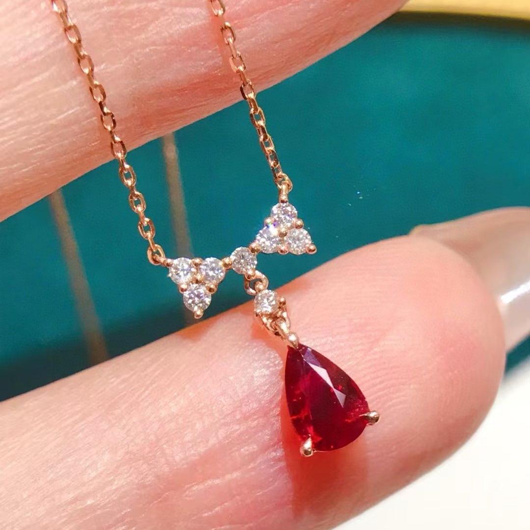 14k Gold 0.66 Ctw Natural Ruby & Diamond Pendant( Without Chain ): Ref:231019219 // gold content:14k gold // main gemstone:ruby // shape:pear // carat weight:0. 5ct // color:red // treatment:natural // // adjacent gemstone 2 : diamond // shape:round // carat