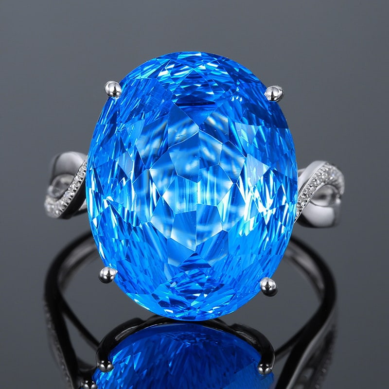 14k Gold 12.35 Ct Natural Topaz & Diamond Ring: Ref:231020010 // gold content:14k gold // ring size:7. 25us // // main gemstone:topaz // shape:oval // carat weight:12. 35ct // color:blue // treatment:natural // // adjacent gemstone 2 : diamond //