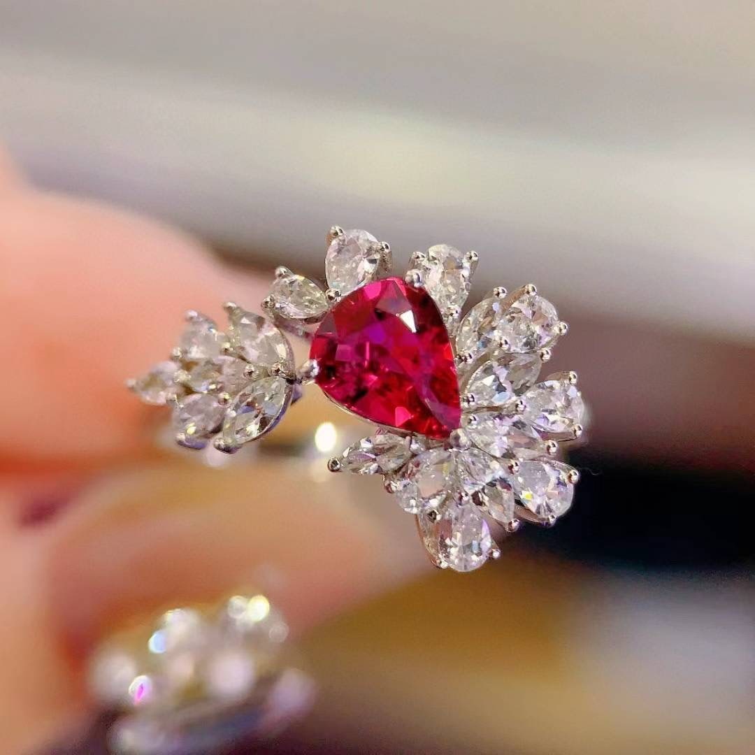 14k Gold 0.75 Ct Natural Ruby & Sapphire Ring: Ref:231020023 // gold content:14k gold // ring size:7. 25us // // main gemstone:ruby // shape:pear // carat weight:0. 75ct // color:red // treatment:natural // // adjacent gemstone 2 : sapphire //