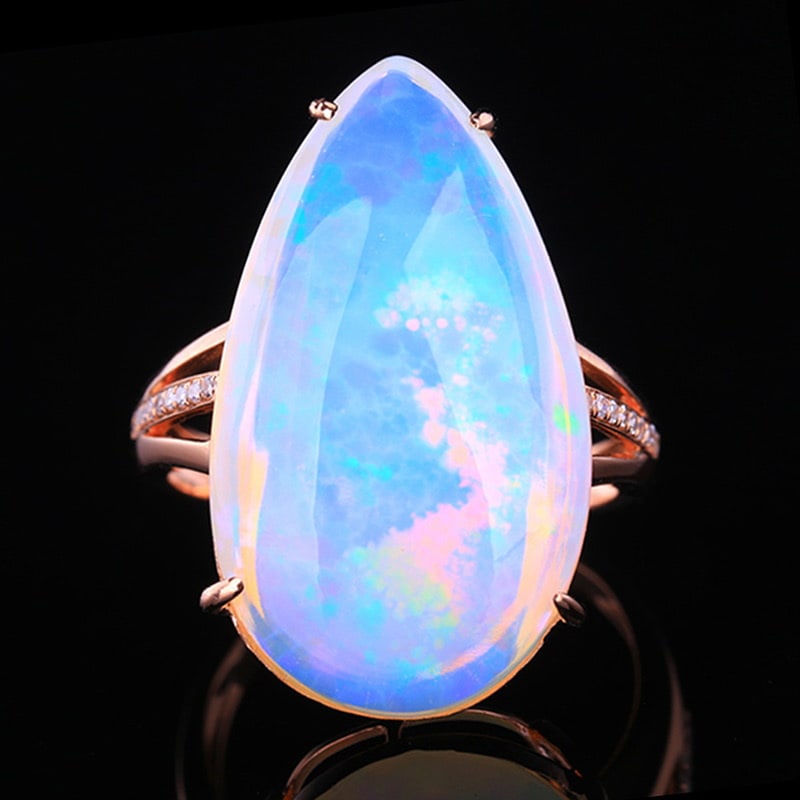 14k Gold 13.62 Ctw Natural Opal & Diamond Ring: Ref:231020029 // gold content:14k gold // ring size:7. 25us // // main gemstone:opal // shape:pear // carat weight:13. 56ct // color:white // treatment:natural // // adjacent gemstone 2 : diamond //
