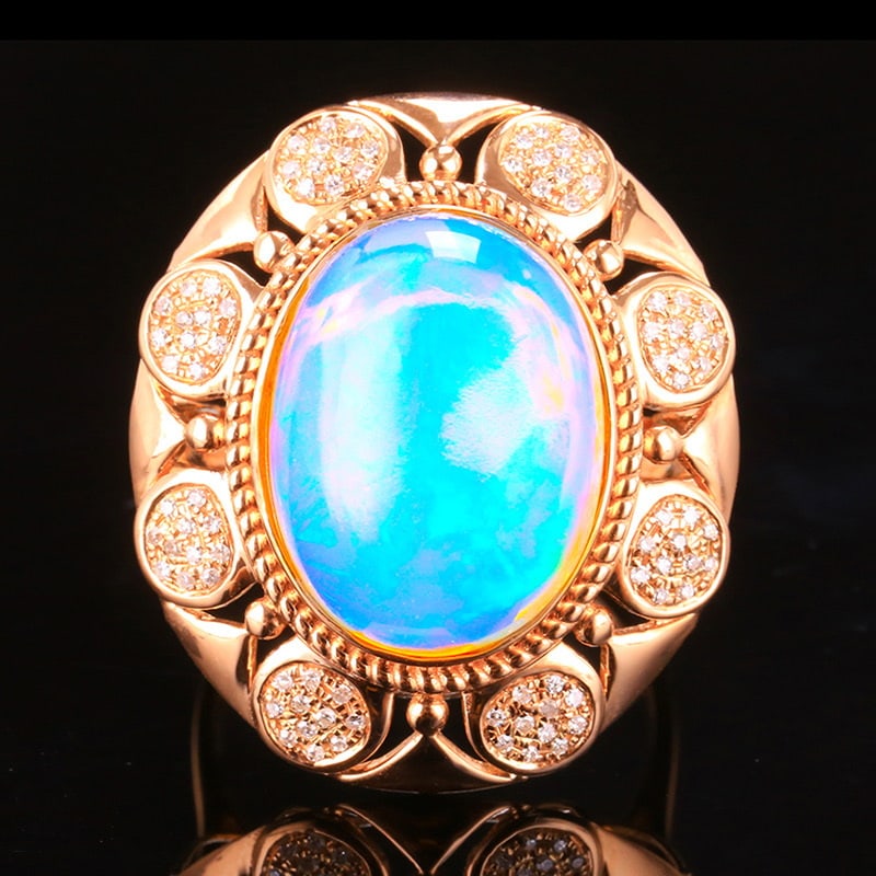 14k Gold 7.26 Ctw Natural Opal & Diamond Ring: Ref:231020030 // gold content:14k gold // ring size:7. 25us // // main gemstone:opal // shape:oval // carat weight:7ct // color:white // treatment:natural // // adjacent gemstone 2 : diamond //