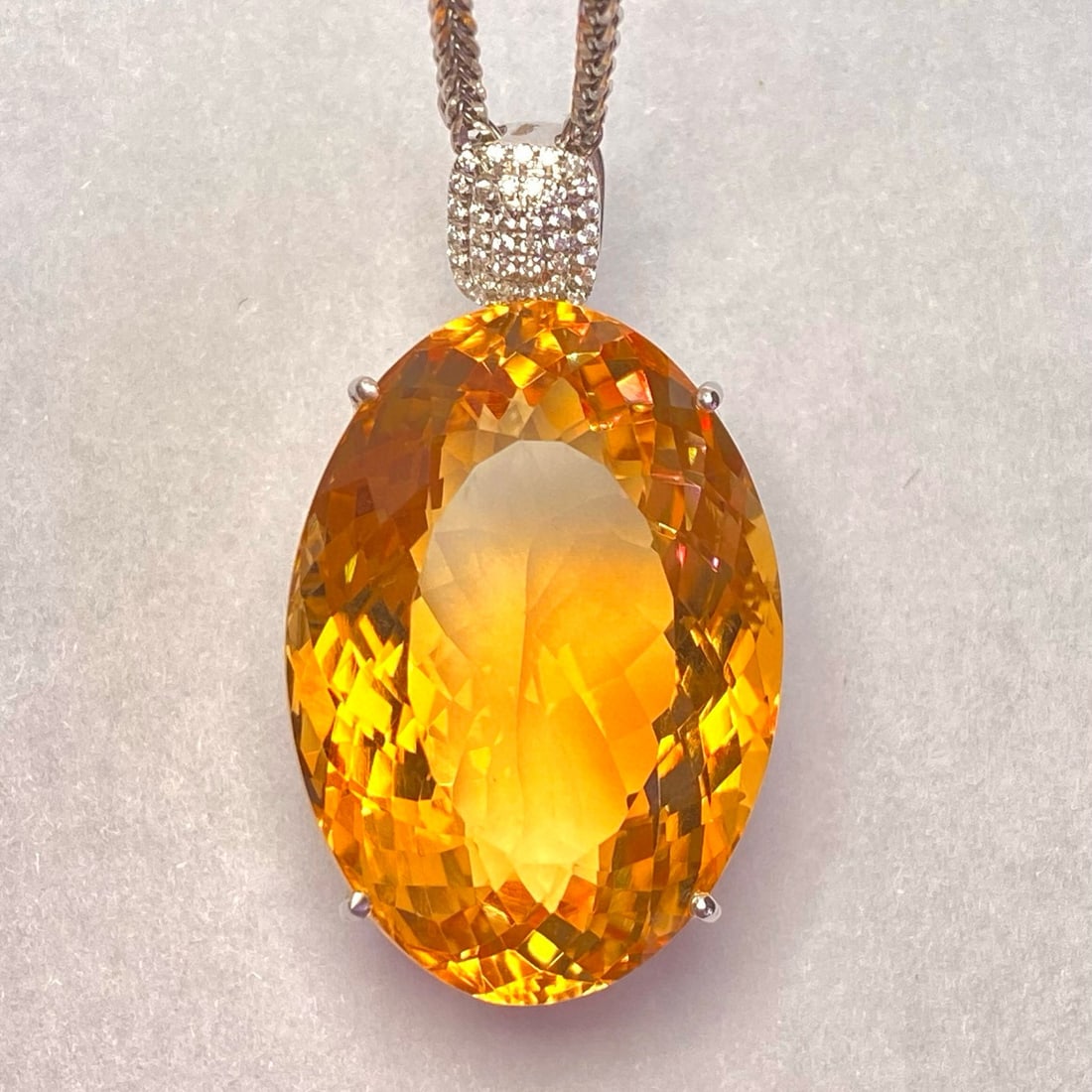 14k Gold 43.45 Ct Natural Citrine & Zircon Pendant( Without Chain ): Ref:231020059 // gold content:14k gold // main gemstone:citrine // shape:oval // carat weight:43. 45ct // color:yellow // treatment:natural // // adjacent gemstone 2 : zircon // number of stones:40 //