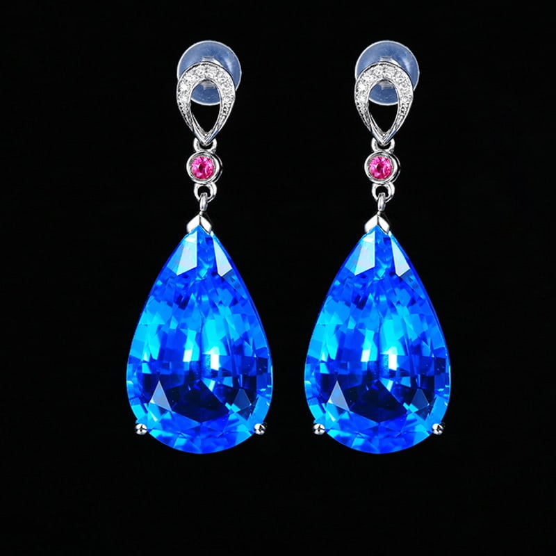 14k Gold 22.43 Ct Natural Topaz & Diamond & Ruby Earrings: Ref:231020101 // gold content:14k gold // main gemstone:topaz // shape:pear // carat weight:22. 43ct // color:blue // treatment:natural // // adjacent gemstone 2 : diamond // shape:round // clarity gr