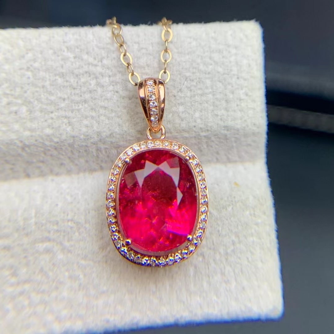 14k Gold 3.49 Ct Natural Tourmaline & Diamond Pendant( Without Chain ): Ref:231020123 // gold content:14k gold // main gemstone:tourmaline // shape:oval // carat weight:3. 49ct // color:red // treatment:natural // // adjacent gemstone 2 : diamond // shape:round //