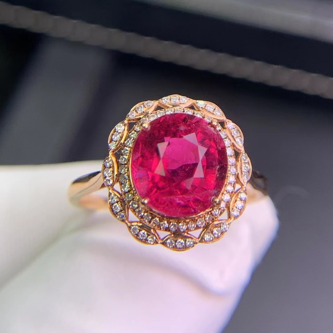 14k Gold 2.8 Ct Natural Tourmaline & Diamond Ring: Ref:231020124 // gold content:14k gold // ring size:7. 25us // // main gemstone:tourmaline // shape:oval // carat weight:2. 8ct // color:red // treatment:natural // // adjacent gemstone 2 : diamond //