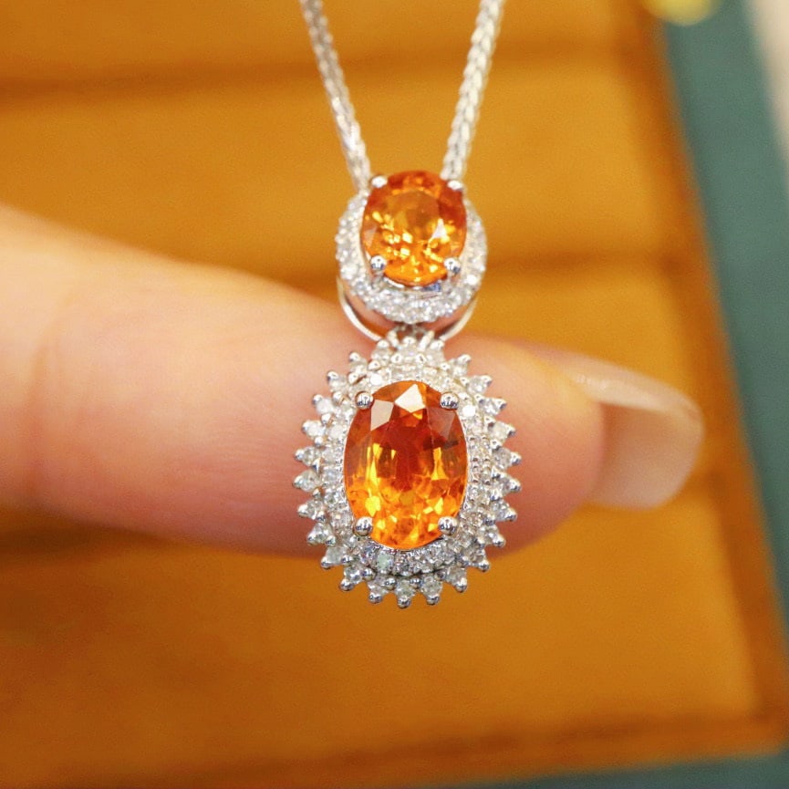 14k Gold 2.22 Ctw Natural Sapphire & Diamond Pendant( Without Chain ): Ref:231020141 // gold content:14k gold // main gemstone:sapphire // shape:oval // carat weight:1. 95ct // color:orange // treatment:natural // // adjacent gemstone 2 : diamond // number of stones:74