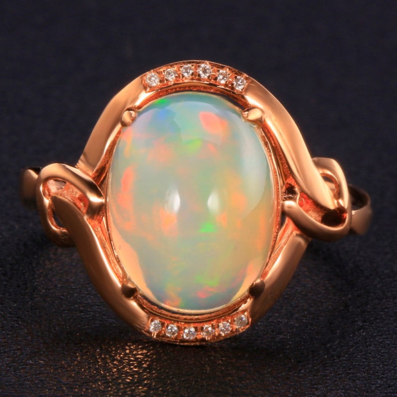 14k Gold 3.85 Ctw Natural Opal & Diamond Ring: Ref:231020143 // gold content:14k gold // ring size:7. 25us // // main gemstone:opal // shape:oval // carat weight:3. 82ct // color:color // treatment:natural // // adjacent gemstone 2 : diamond //