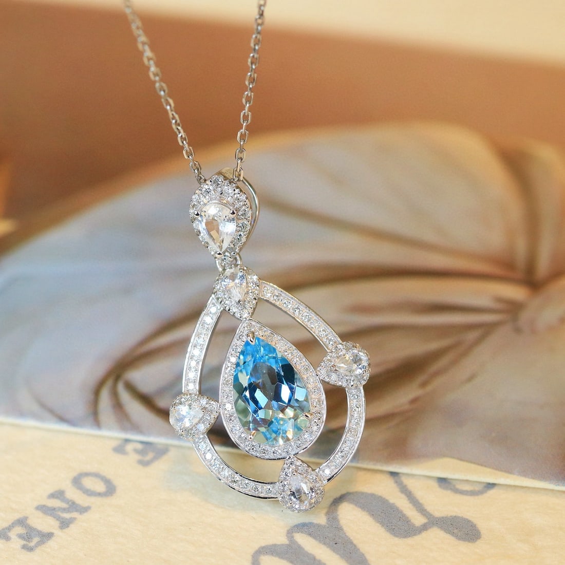 14k Gold 1.65 Ctw Natural Aquamarine & Sapphire Pendant( Without Chain ): Ref:231020157 // gold content:14k gold // main gemstone:aquamarine // shape:pear // carat weight:1. 20ct // color:santa maria color // treatment:natural // // adjacent gemstone 2 : sapphire // shape:p