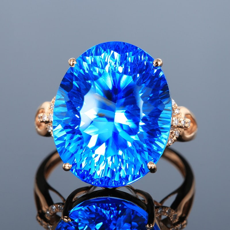 14k Gold 18.21 Ct Natural Topaz & Diamond Ring: Ref:231020162 // gold content:14k gold // ring size:7. 25us // // main gemstone:topaz // shape:oval // carat weight:18. 21ct // color:blue // treatment:natural // // adjacent gemstone 2 : diamond //