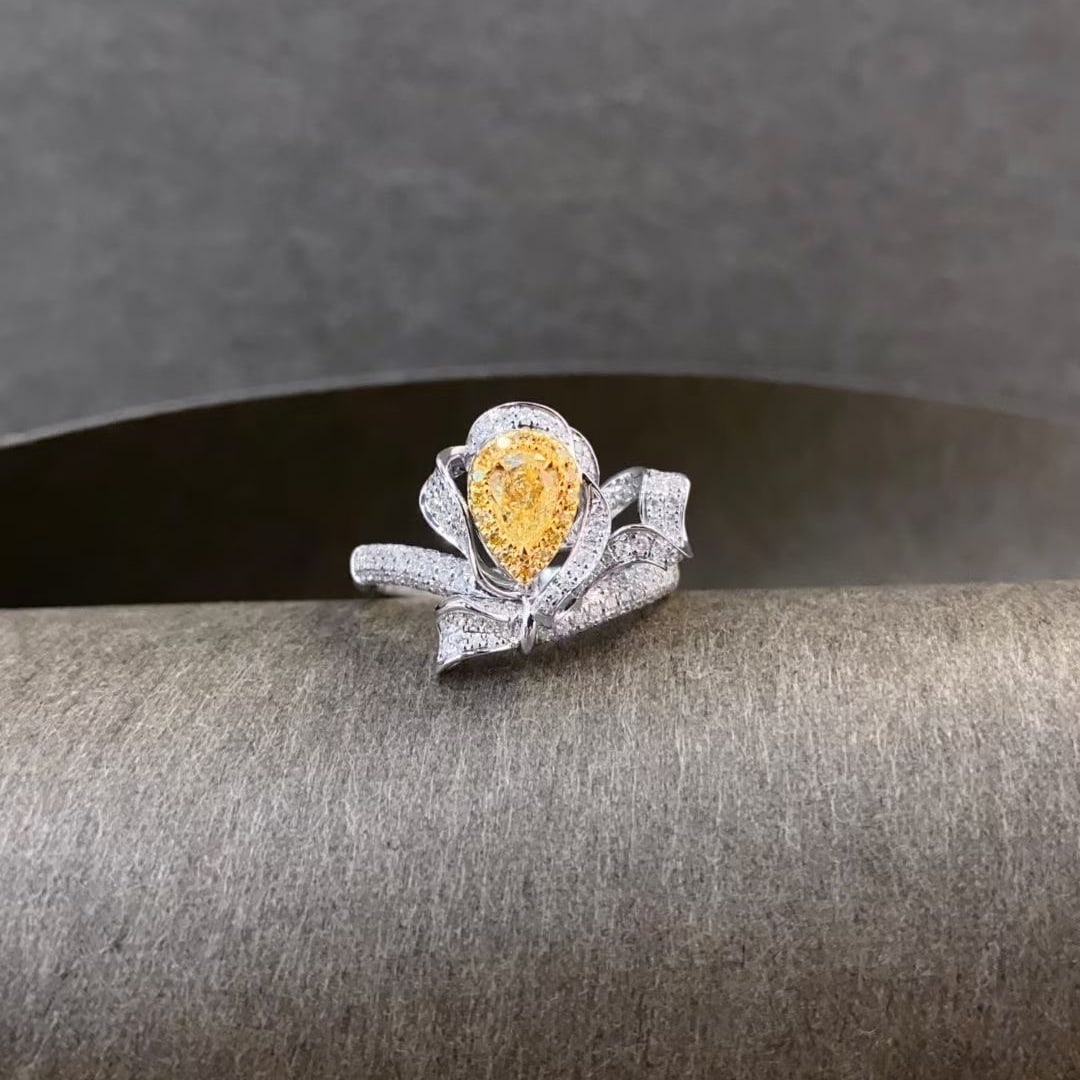 14k Gold 0.85 Ctw Natural Yellow Diamond & Diamond Ring: Ref:231020181 // gold content:14k gold // ring size:7. 25us // // main gemstone:yellow diamond // shape:pear // carat weight:0. 35ct // color:yellow // treatment:natural // // adjacent gemstone 2 :