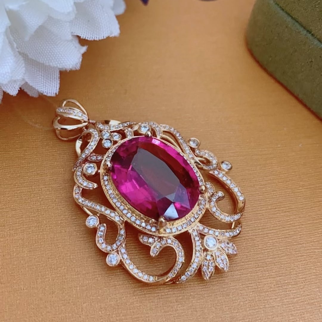 14k Gold 8.7 Ct Natural Tourmaline & Diamond Pendant( Without Chain ): Ref:231020196 // gold content:14k gold // main gemstone:tourmaline // shape:oval // carat weight:8. 7ct // color:red // treatment:natural // // adjacent gemstone 2 : diamond // shape:round // clarity
