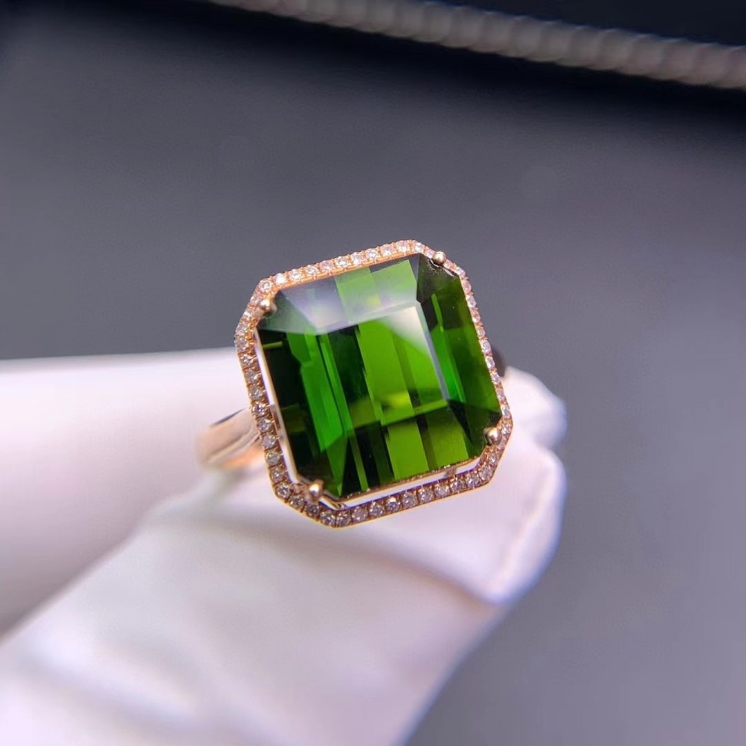 14k Gold 7.3 Ct Natural Tourmaline & Diamond Ring: Ref:231020213 // gold content:14k gold // ring size:7. 25us // // main gemstone:tourmaline // shape:octagonal // carat weight:7. 3ct // color:green // treatment:natural // // adjacent gemstone 2 :