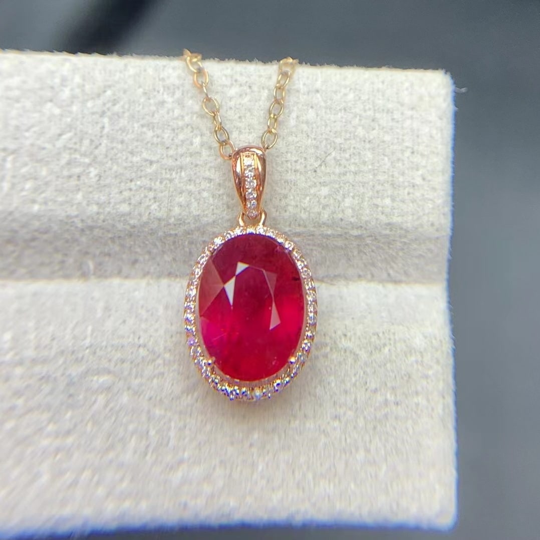 14k Gold 2.9 Ct Natural Tourmaline & Diamond Pendant( Without Chain ): Ref:231020215 // gold content:14k gold // main gemstone:tourmaline // shape:oval // carat weight:2. 9ct // color:red // treatment:natural // // adjacent gemstone 2 : diamond // shape:round // clarity