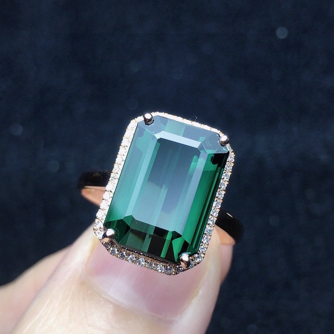 14k Gold 6.68 Ct Natural Tourmaline & Diamond Ring: Ref:231020217 // gold content:14k gold // ring size:7. 25us // // main gemstone:tourmaline // shape:octagonal // carat weight:6. 68ct // color:green // treatment:natural // // adjacent gemstone 2 :