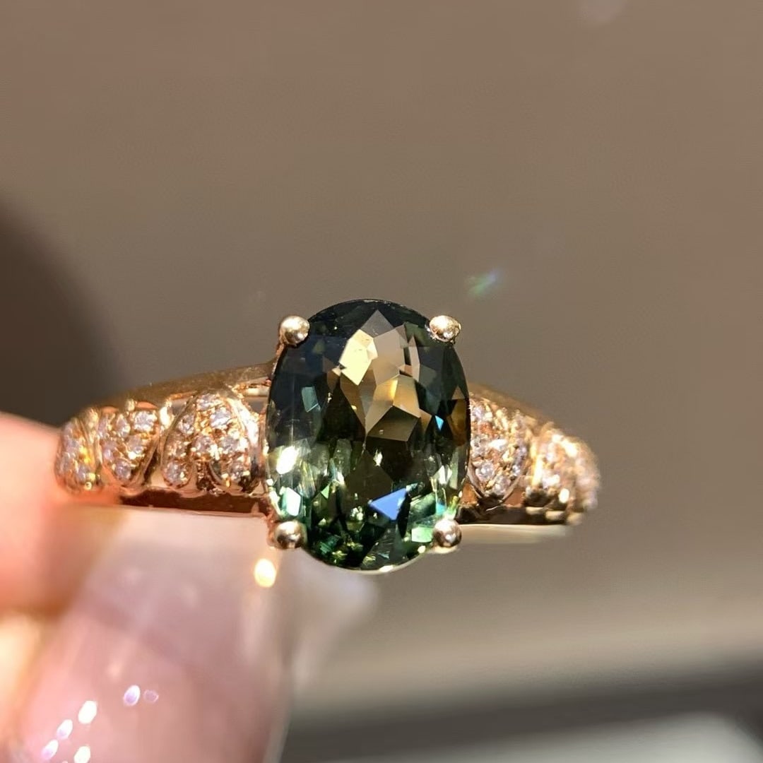 14k Gold 2.1 Ct Natural Tourmaline & Diamond Ring: Ref:231020218 // gold content:14k gold // ring size:7. 25us // // main gemstone:tourmaline // shape:oval // carat weight:2. 1ct // color:green // treatment:natural // // adjacent gemstone 2 : diamond
