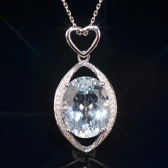 14k Gold 6.14 Ctw Natural Topaz & Diamond Pendant( Without Chain ): Ref:231020220 // gold content:14k gold // main gemstone:topaz // shape:oval // carat weight:6. 05ct // color:blue // treatment:natural // // adjacent gemstone 2 : diamond // shape:round // carat