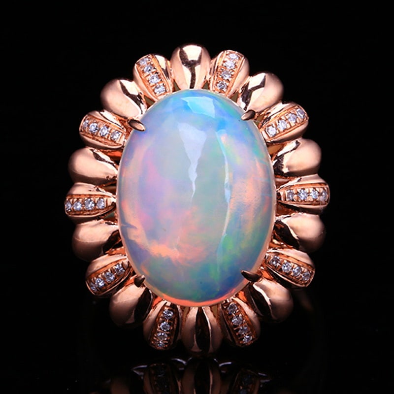 14k Gold 5.77 Ctw Natural Opal & Diamond Ring: Ref:231020229 // gold content:14k gold // ring size:7. 25us // // main gemstone:opal // shape:oval // carat weight:5. 65ct // color:color // treatment:natural // // adjacent gemstone 2 : diamond //