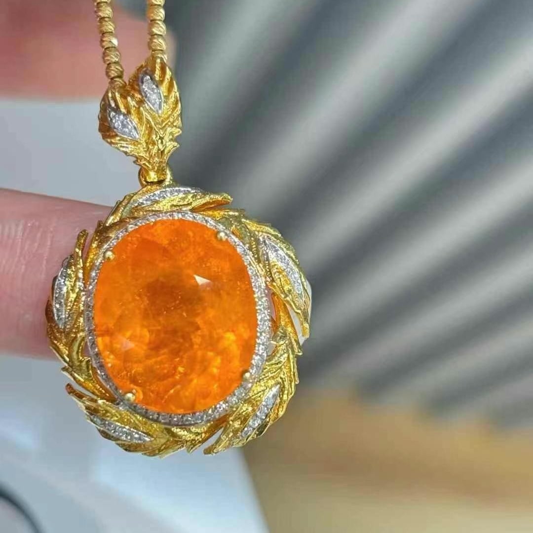 14k Gold 11.75 Ct Natural Spessartine & Diamond Pendant( Without Chain ): Ref:231020262 // gold content:14k gold // main gemstone:spessartine // shape:oval // carat weight:11. 75ct // color:orange // treatment:natural // // adjacent gemstone 2 : diamond // shape:round //