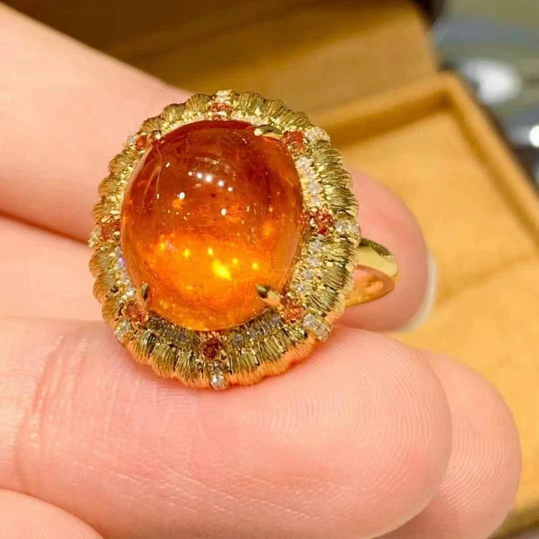 14k Gold 10.3 Ct Natural Spessartine & Diamond Ring: Ref:231020263 // gold content:14k gold // ring size:7. 25us // // main gemstone:spessartine // shape:oval // carat weight:10. 3ct // color:orange // treatment:natural // // adjacent gemstone 2 :
