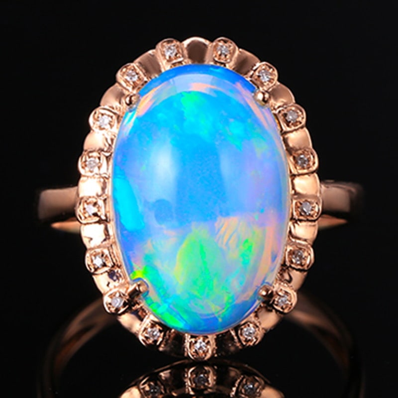 14k Gold 3.72 Ctw Natural Opal & Diamond Ring: Ref:231020275 // gold content:14k gold // ring size:7. 25us // // main gemstone:opal // shape:oval // carat weight:3. 67ct // color:white // treatment:natural // // adjacent gemstone 2 : diamond //