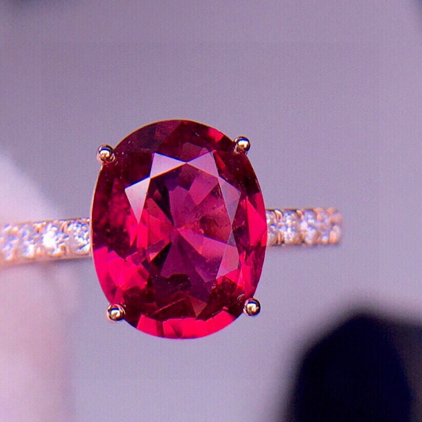 14k Gold 2.96 Ct Natural Tourmaline & Diamond Ring: Ref:231020280 // gold content:14k gold // ring size:7. 25us // // main gemstone:tourmaline // shape:oval // carat weight:2. 96ct // color:red // treatment:natural // // adjacent gemstone 2 : diamond