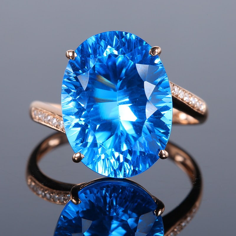 14k Gold 10.39 Ct Natural Topaz & Diamond Ring: Ref:231020303 // gold content:14k gold // ring size:7. 25us // // main gemstone:topaz // shape:oval // carat weight:10. 39ct // color:blue // treatment:natural // // adjacent gemstone 2 : diamond //