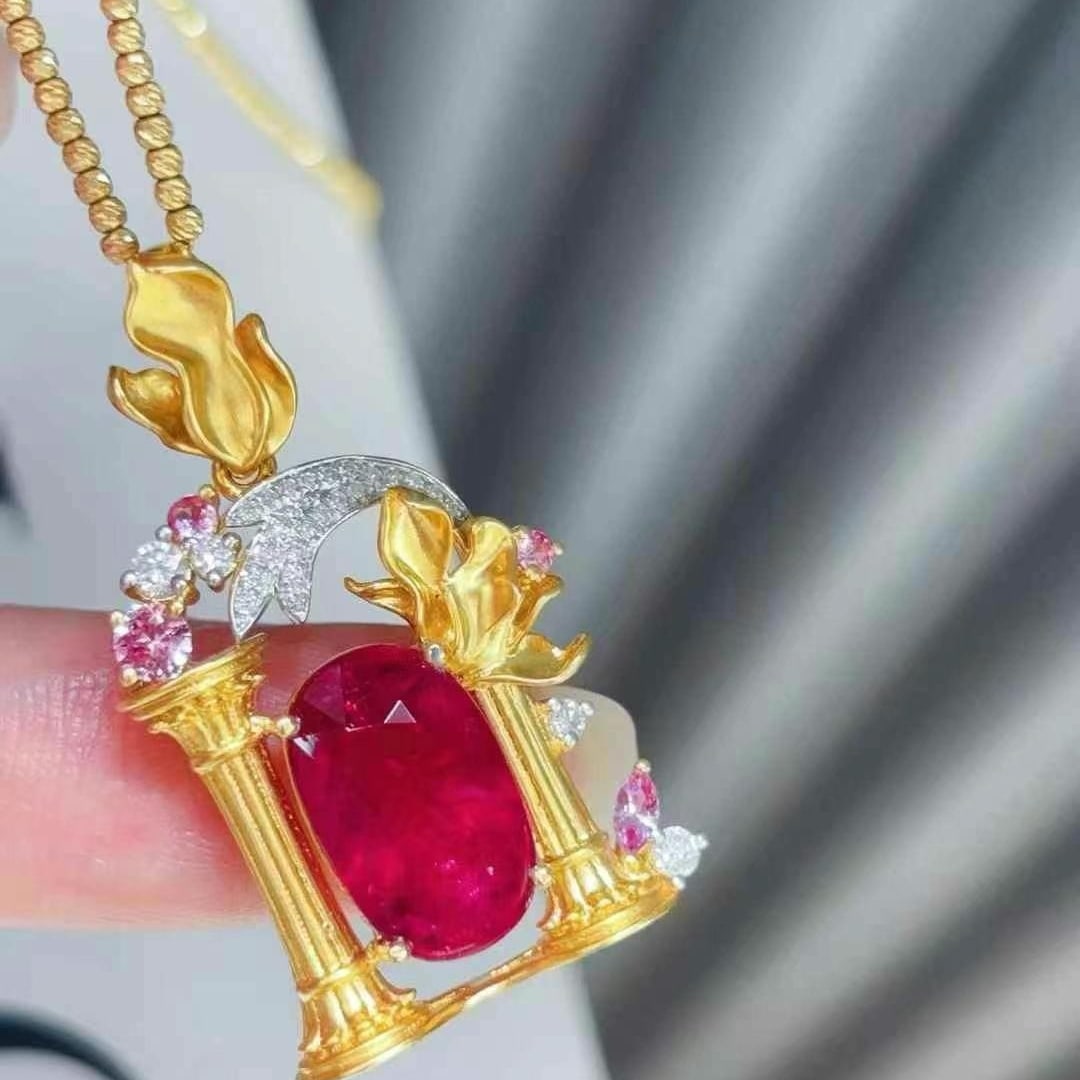 14k Gold 5.07 Ct Natural Tourmaline & Diamond & Sapphire Pendant( Without Chain ): Ref:231020320 // gold content:14k gold // main gemstone:tourmaline // shape:oval // carat weight:5. 07ct // color:red // treatment:natural // // adjacent gemstone 2 : diamond // shape:round //
