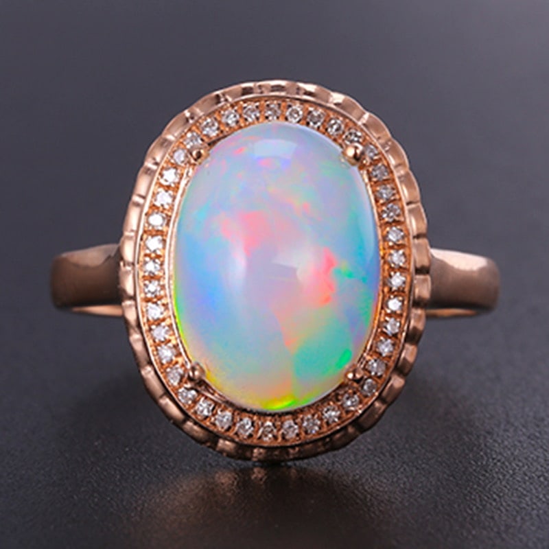 14k Gold 3.16 Ctw Natural Opal & Diamond Ring: Ref:231020361 // gold content:14k gold // ring size:7. 25us // // main gemstone:opal // shape:oval // carat weight:3. 04ct // color:white // treatment:natural // // adjacent gemstone 2 : diamond // sh