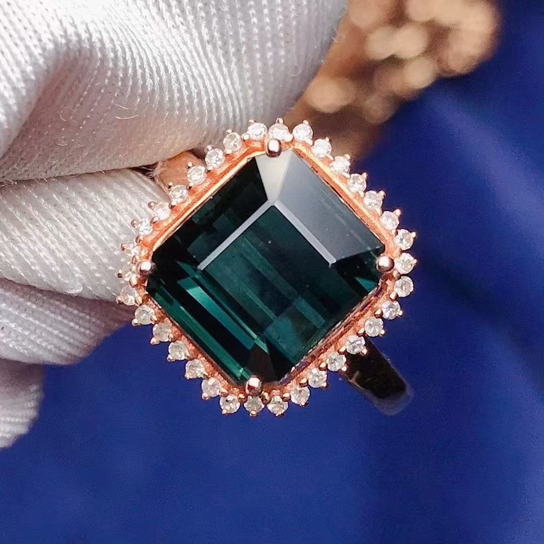 14k Gold 4.5 Ct Natural Tourmaline & Diamond Ring: Ref:231020368 // gold content:14k gold // ring size:7. 25us // // main gemstone:tourmaline // shape:octagonal // carat weight:4. 5ct // color:bluish green // treatment:natural // // adjacent gemstone