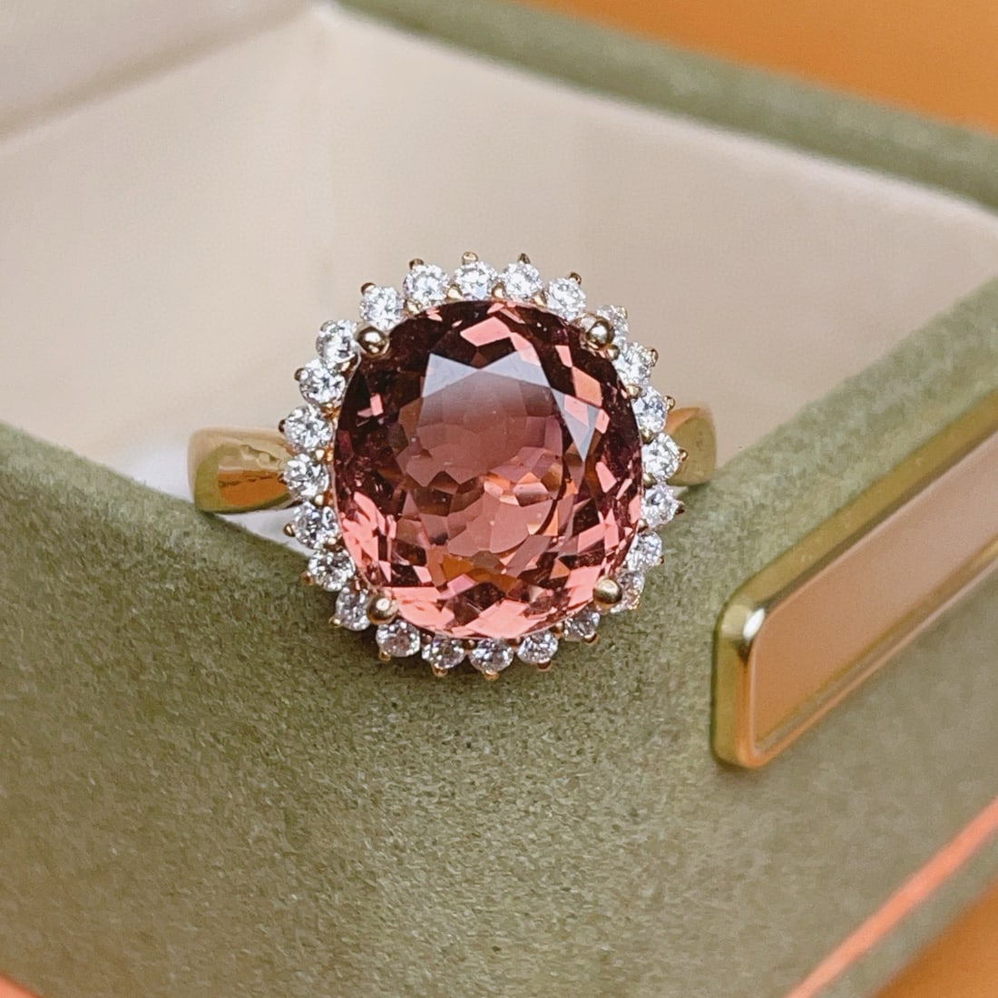 14k Gold 6.1 Ct Natural Tourmaline & Diamond Ring: Ref:231020377 // gold content:14k gold // ring size:7. 25us // // main gemstone:tourmaline // shape:oval // carat weight:6. 1ct // color:orangish pink // treatment:natural // // adjacent gemstone 2 :