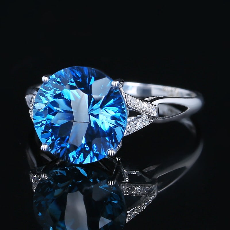 14k Gold 4.81 Ct Natural Topaz & Diamond Ring: Ref:231020400 // gold content:14k gold // ring size:7. 25us // // main gemstone:topaz // shape:round // carat weight:4. 81ct // color:blue // treatment:natural // cut grade:g // // adjacent gemstone