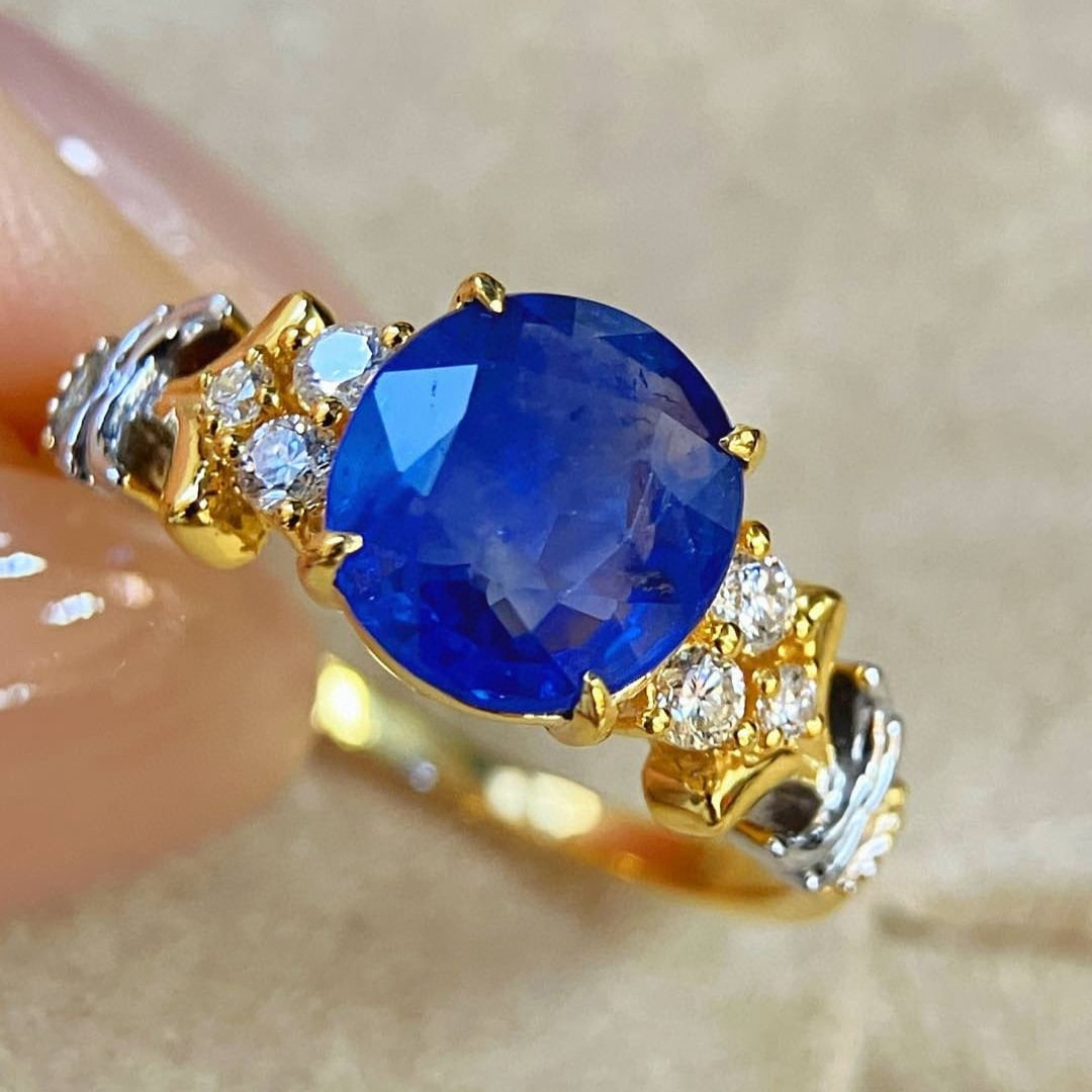 14k Gold 2.27 Ctw Natural Sapphire & Diamond Ring: Ref:231020405 // gold content:14k gold // ring size:7. 25us // // main gemstone:sapphire // shape:oval // carat weight:2. 09ct // color:royal blue // treatment:natural // // adjacent gemstone 2 : diam