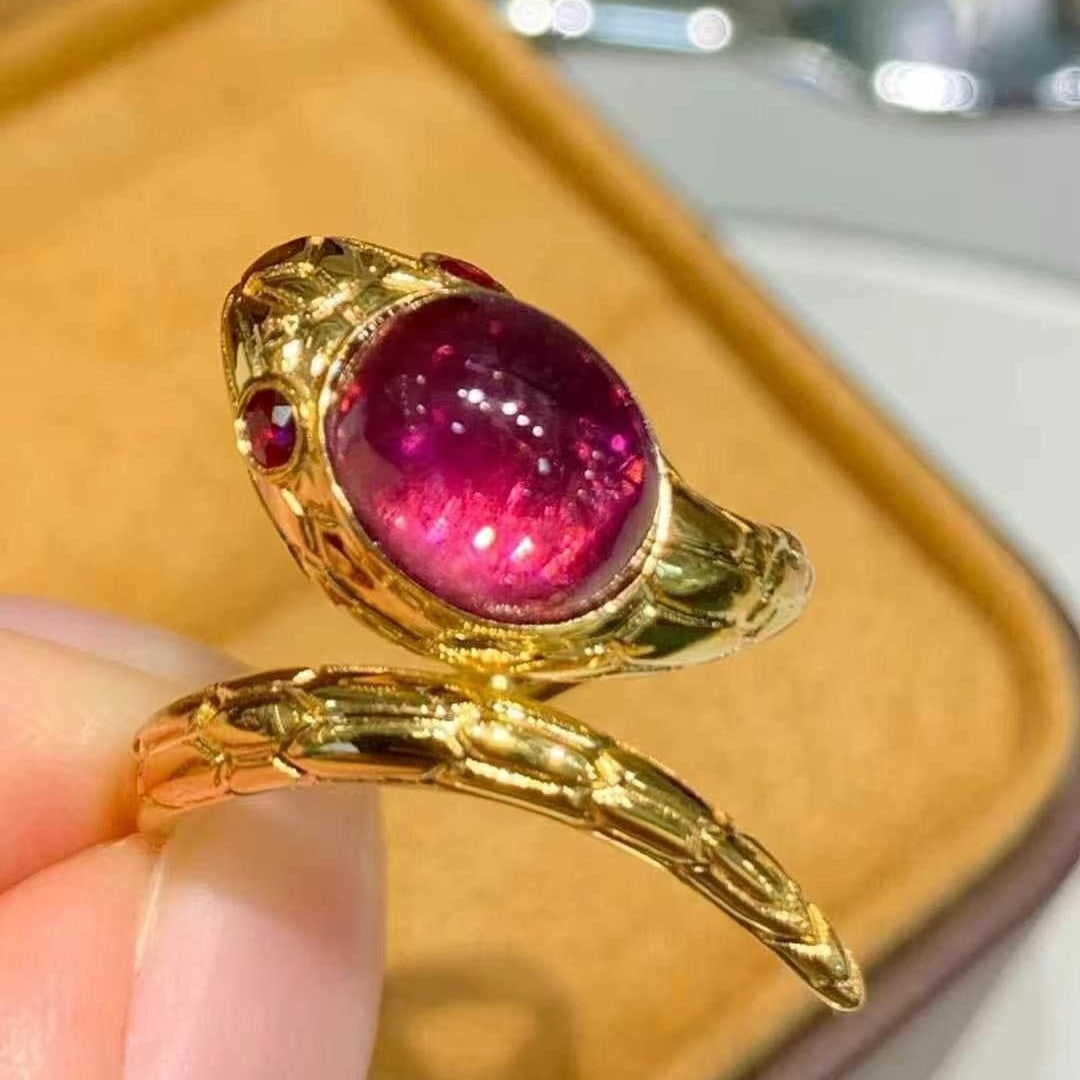 14k Gold 3.3 Ct Natural Tourmaline & Ruby Ring: Ref:231020413 // gold content:14k gold // ring size:7. 25us // // main gemstone:tourmaline // shape:oval // carat weight:3. 3ct // color:red // treatment:natural // // adjacent gemstone 2 : ruby //