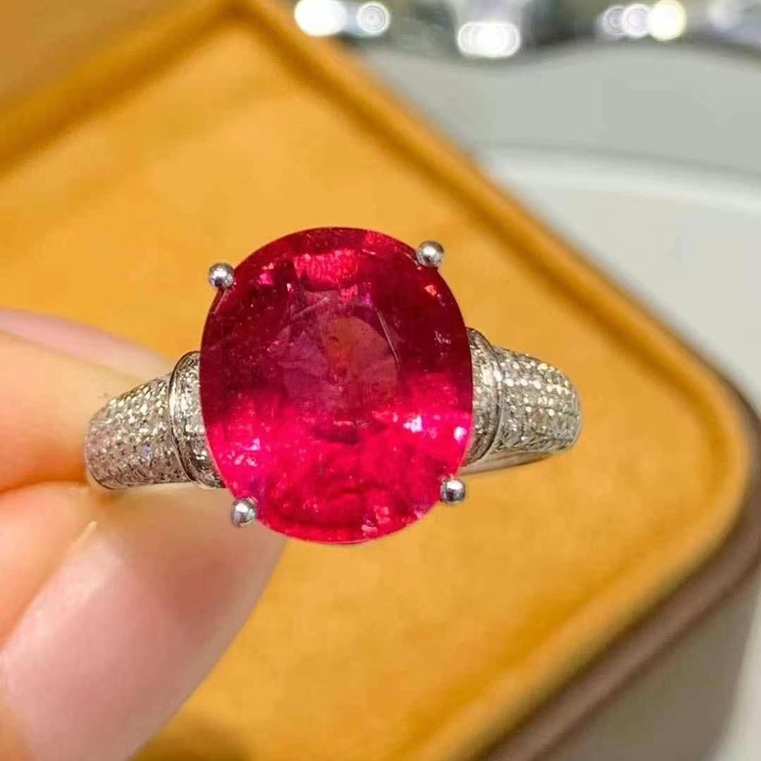 14k Gold 5.8 Ct Natural Tourmaline & Diamond Ring: Ref:231020419 // gold content:14k gold // ring size:7. 25us // // main gemstone:tourmaline // shape:oval // carat weight:5. 8ct // color:red // treatment:natural // // adjacent gemstone 2 : diamond