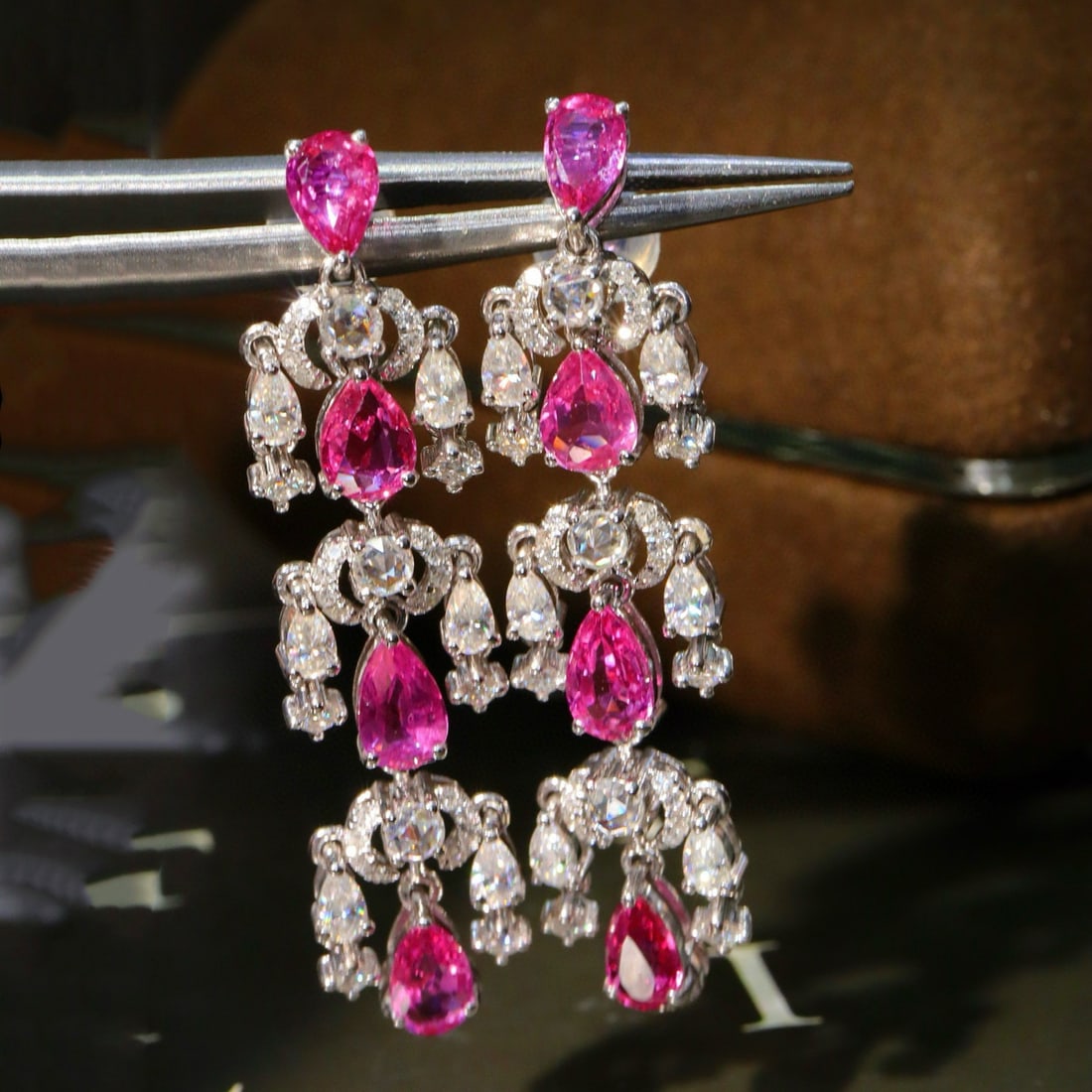 14k Gold 3.41 Ctw Natural Ruby & Diamond Earrings: Ref:231029007 // gold content:14k gold // main gemstone:ruby // shape:pear // carat weight:3. 19ct // color:red // treatment:natural // // adjacent gemstone 2 : diamond // shape:multiply // carat weig