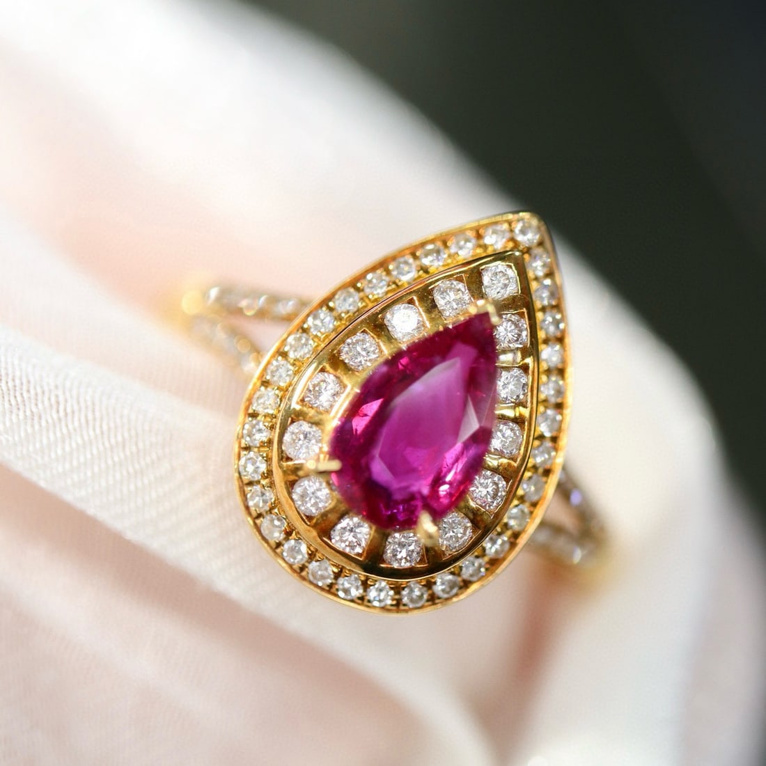 14k Gold 1.18 Ctw Natural Ruby & Diamond Ring: Ref:231029029 // gold content:14k gold // ring size:7. 25us // // main gemstone:ruby // shape:pear // carat weight:0. 84ct // color:purplish red // treatment:natural // // adjacent gemstone 2 :