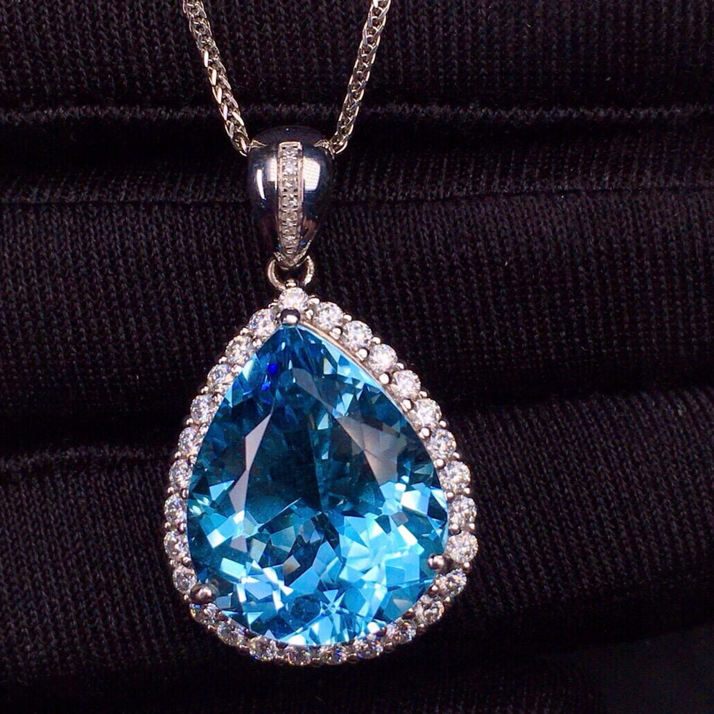 14k Gold 14.9 Ct Natural Topaz & Diamond Pendant( Without Chain ): Ref:231029045 // gold content:14k gold // main gemstone:topaz // shape:pear // carat weight:14. 9ct // color:blue // treatment:natural // // adjacent gemstone 2 : diamond // shape:round // clarity