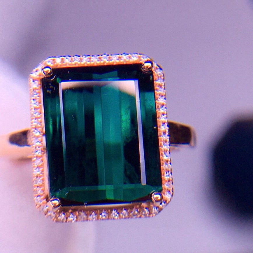 14k Gold 5.8 Ct Natural Tourmaline & Diamond Ring: Ref:231029047 // gold content:14k gold // ring size:7. 25us // // main gemstone:tourmaline // shape:octagonal // carat weight:5. 8ct // color:green // treatment:natural // // adjacent gemstone 2 :