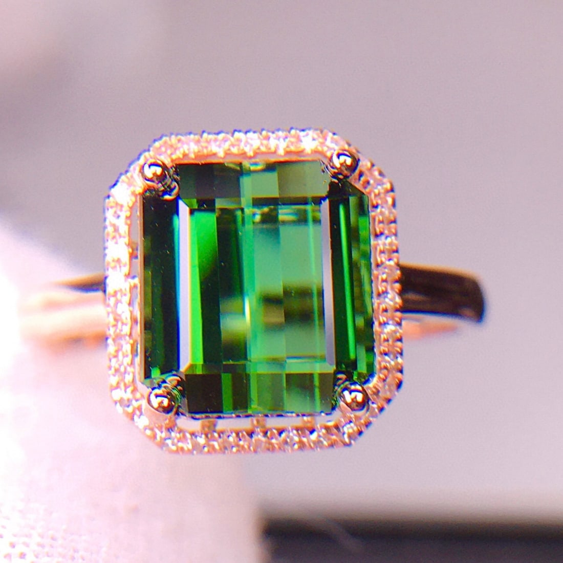 14k Gold 5.2 Ct Natural Tourmaline & Diamond Ring: Ref:231029064 // gold content:14k gold // ring size:7. 25us // // main gemstone:tourmaline // shape:octagonal // carat weight:5. 2ct // color:green // treatment:natural // // adjacent gemstone 2 :