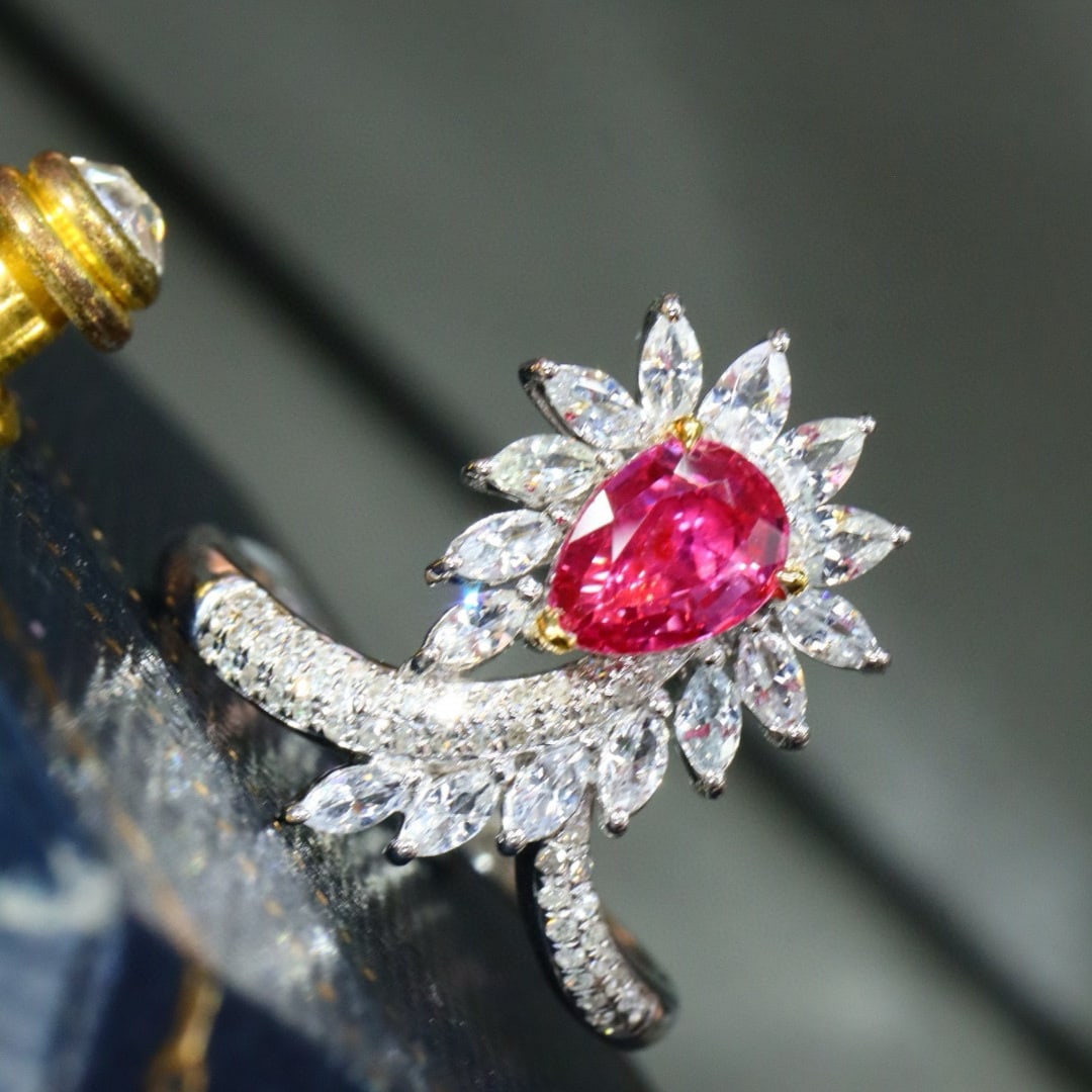 14k Gold 1.09 Ctw Natural Padparadscha Sapphire & Diamond Ring: Ref:231029196 // gold content:14k gold // ring size:7. 25us // // main gemstone:padparadscha sapphire // shape:pear // carat weight:0. 94ct // color:pink // treatment:natural // cut grade:g // //