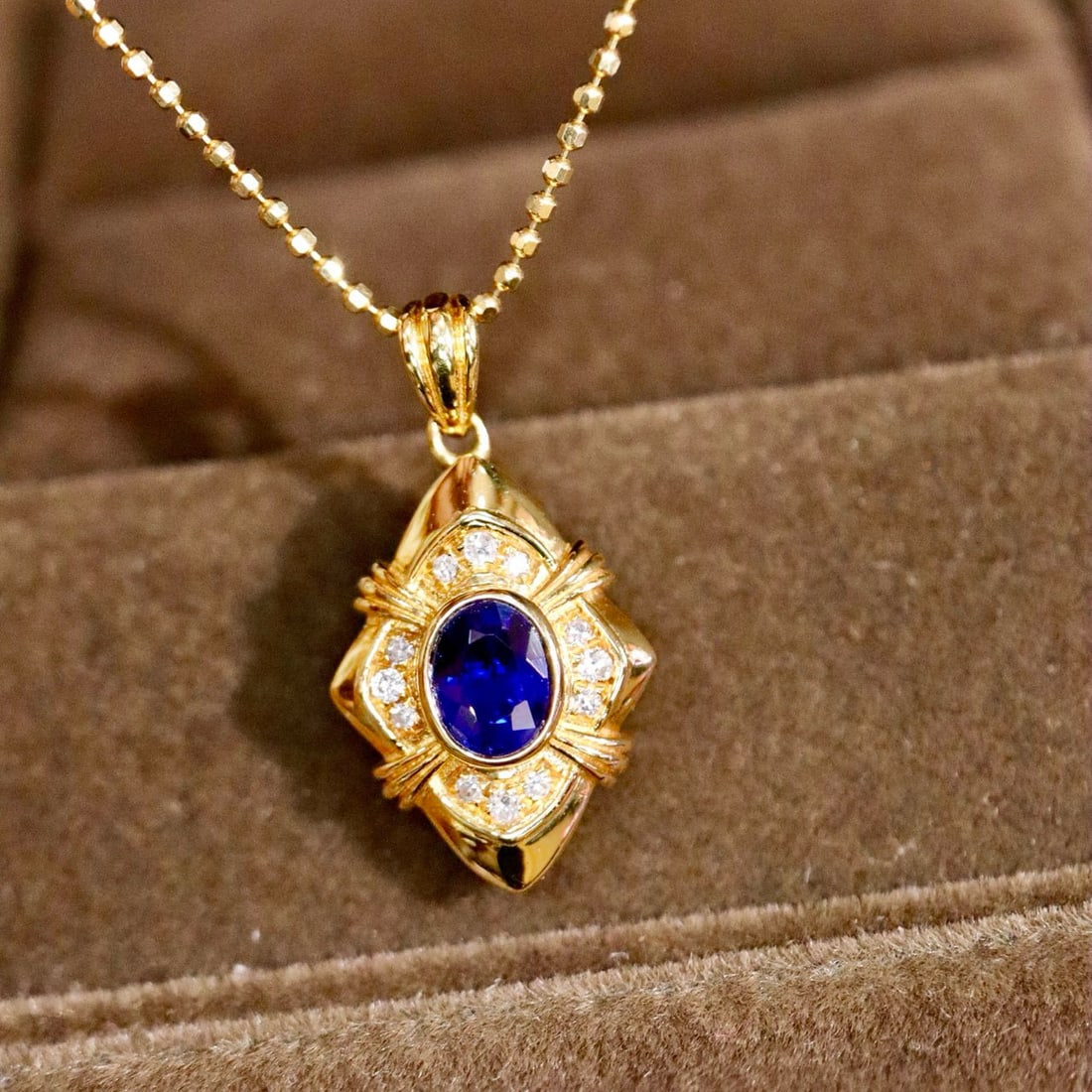 14k Gold 0.46 Ctw Natural Sapphire & Diamond Pendant( Without Chain ): Ref:231029211 // gold content:14k gold // main gemstone:sapphire // shape:oval // carat weight:0. 41ct // color:blue // treatment:natural // cut grade:g // // adjacent gemstone 2 : diamond //