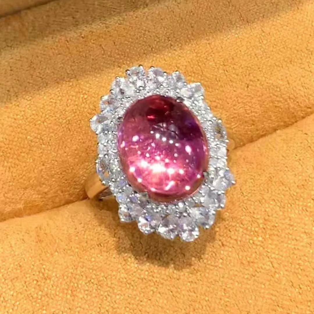14k Gold 5.6 Ct Natural Tourmaline & Diamond Ring: Ref:231029259 // gold content:14k gold // ring size:7. 25us // // main gemstone:tourmaline // shape:oval // carat weight:5. 6ct // color:pink // treatment:natural // cut grade:g // // adjacent